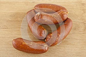 Sausage on a wooden background