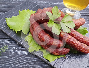 Sausages beer salad leaf pork board food organic dinner gourmet kitchen on a wooden background lettuce table