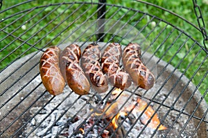 Sausages being barbequed