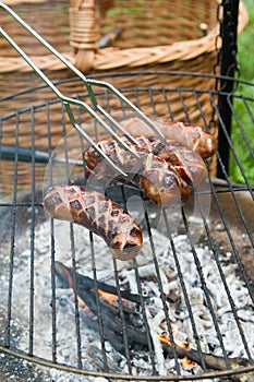 Sausages being barbequed