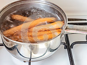 sausages boiling in a kettle