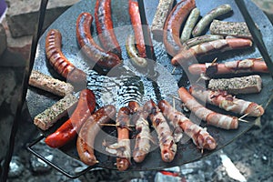 Sausages at the camp fire photo