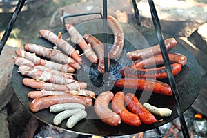 Sausages at the camp fire photo