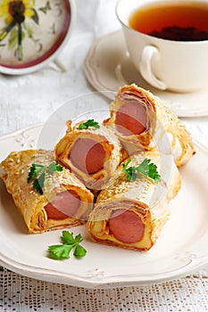 Sausages with cheese in lavash for a breackfast