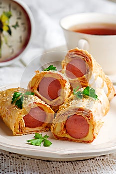 Sausages with cheese in lavash for a breackfast