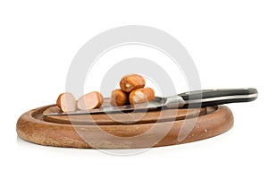 sausages on chopping board on isolated on white background