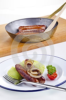 Sausages with green mashed potato