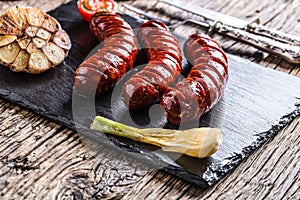 Sausages. Grill sausages. Grilled sausage with mushrooms garlic tomatoes and onions