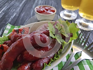 Sausages grilled beer salad recipe fried nutrition kitchen on a wooden background lettuce table