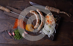 Sausages grilled food background, wood background.