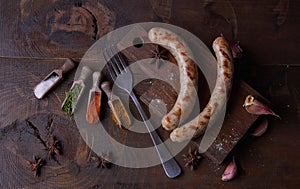 Sausages grilled food background, wood background.