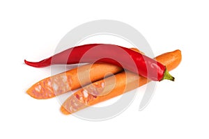 Sausages and hot chili pepper isolated on white background