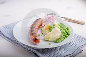 Sausages with mash and some peas