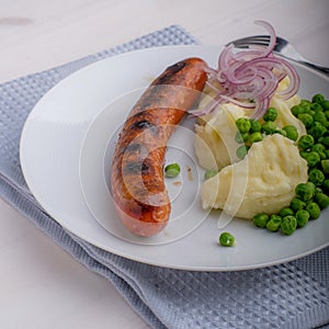 Sausages with mash and some peas