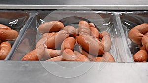 Sausages. Packing line of sausage.