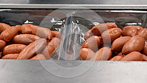 Sausages. Packing line of sausage.