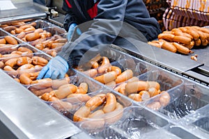 Sausages. Packing line of sausage. Industrial manufacture of sausage products.