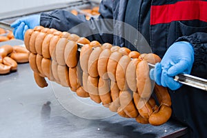Sausages. Packing line of sausage. Industrial manufacture of sausage products.