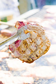 Sausages and pork steaks on the large barbeque