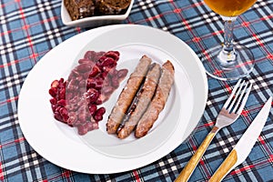 Sausages with red beans, typical Catalan dish butifarra con alubias photo