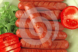 Sausages served with tomato