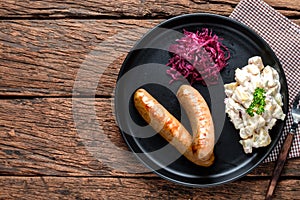 Sausages Traditional, Mashed Potato with red Cabbage on Black Plate, Flat lay