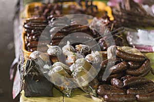 Sausages and typical Laotian food at the Muang Khua market