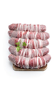 Sausages wrapped in bacon isolated on white background