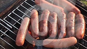 Sausagesfried on a grill fire flame grill