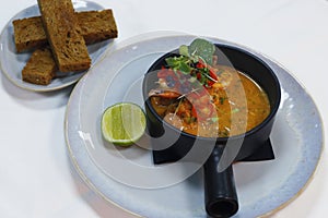 sauted king prawns in spicy tomato sauce with toasted bread