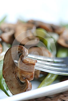 Sauted mushrooms with green beans photo