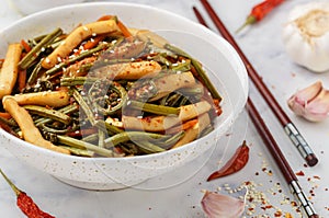 Sauteed bracken fern weit squid, red pepper, carrot, garlic, soy sauce and sesame seeds