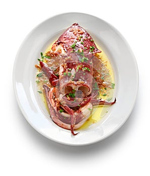 Sauteed calamari with parsley and garlic, spanish tapas food photo