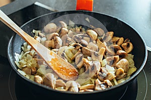 Sauteed mushrooms with onions in the pan