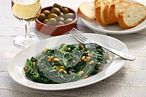 Sauteed spinach with raisins and pine nuts, catalan spinach photo