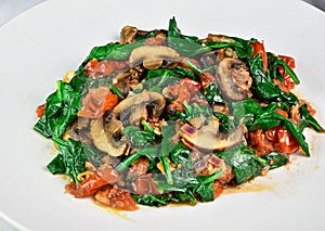 sauteed spinach , tomatoes and mushrooms