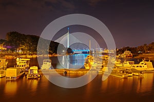 Sava river, marina and Ada bridge in Belgrade, Serbia - night picture