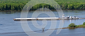 Ingram Barge Co moving a set of hopper barges along the Mississippi river