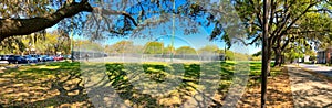 SAVANNAH, GA - APRIL 3RD, 2018: Tourists walk along beautiful city park, panoramic view. - Panoramic view