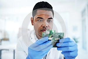 The savant in IT system maintenance. a young man repairing computer hardware in a laboratory. photo