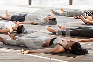 Savasana Pose. Diverse Yoga Class Members Meditating On Floor, Lying On Mats