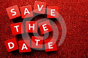 Save the Date alphabet letter on red glitter background