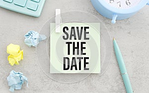 SAVE THE DATE text on the notebook