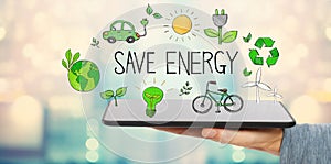 Save Energy with man holding a tablet