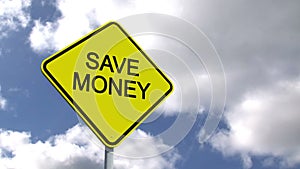 Save money sign against blue sky