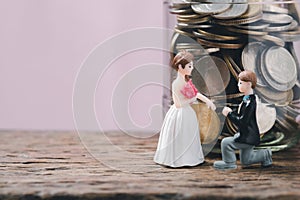 Save money for wedding and planning wedding concept. Sustainable financial goal for family life or married life. Miniature wedding