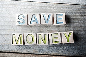 Save Money Written On Wooden Blocks On A Board