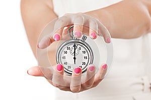 Save Time Concept. Two Woman Hands Protecting Stopwatch.