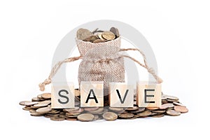 Save word on blocks of wooden. Money bags and coins on white background.Time to invest, time value for money, money saving,