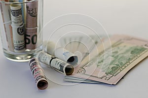 Saving and accumulating dollar banknotes are on white background